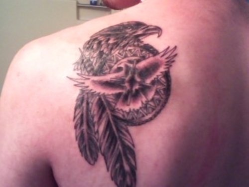 Grey Ink Flying Bird And Dreamcatcher Tattoo On Left Back Shoulder